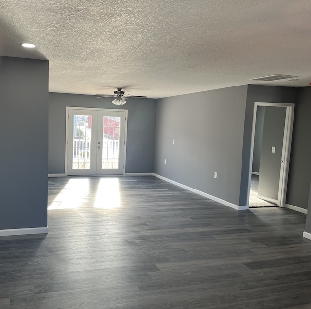 506 E Mill St, Kirksville, MO 63501 - empty room featuring visible vents, baseboards, a ceiling fan, dark wood finished floors, and french doors