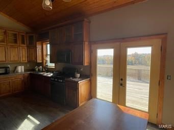 kitchen with french doors, black range oven, wooden ceiling, and vaulted ceiling