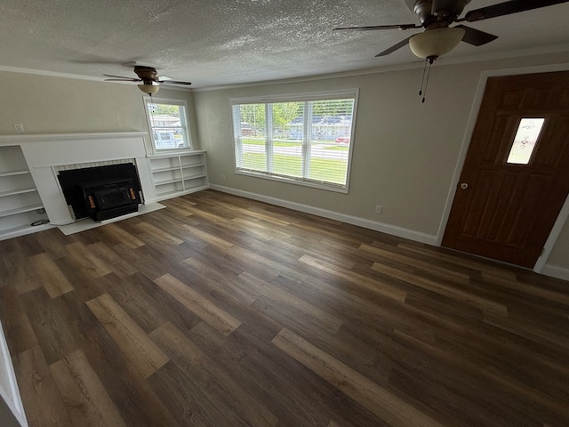 713 E Dear St, Kirksville, MO 63501 - unfurnished living room featuring ceiling fan, dark wood-style floors, baseboards, a textured ceiling, and a fireplace with flush hearth