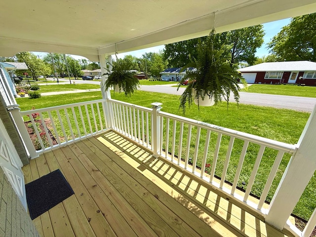 713 E Dear St, Kirksville, MO 63501 - wooden deck featuring a porch and a lawn