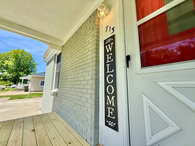 713 E Dear St, Kirksville, MO 63501 - property entrance featuring brick siding and a porch