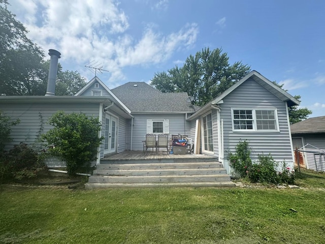 228 S Vine St, Milan, MO 63556 - back of property featuring a yard, french doors, and a deck