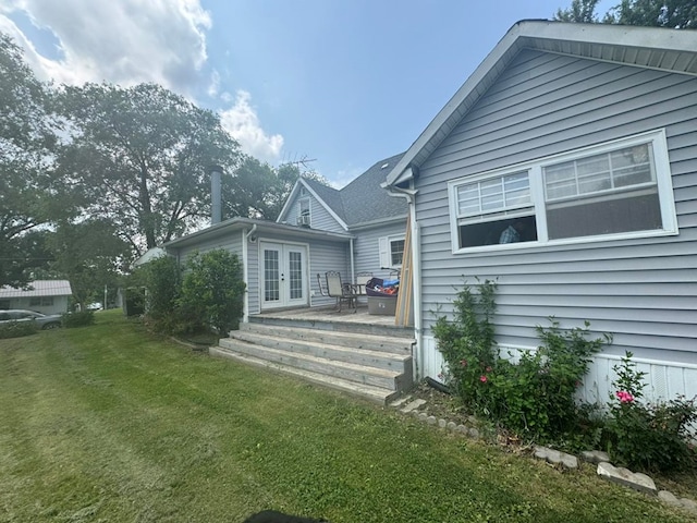 228 S Vine St, Milan, MO 63556 - back of house with french doors and a yard