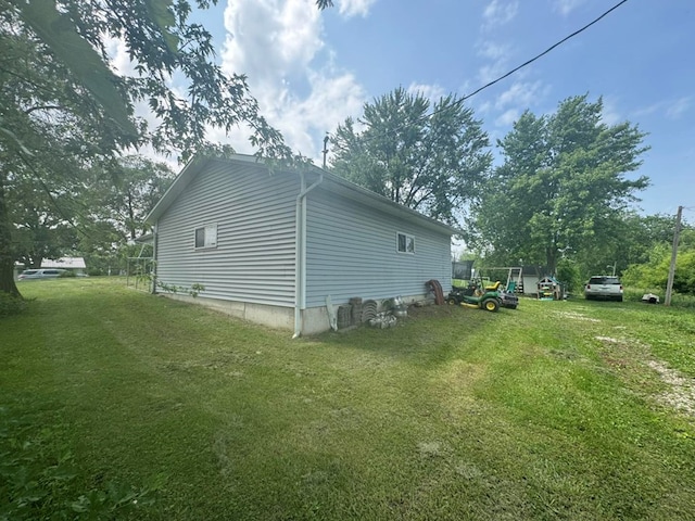 228 S Vine St, Milan, MO 63556 - view of property exterior with a yard