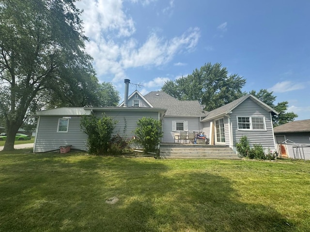 228 S Vine St, Milan, MO 63556 - back of house featuring a lawn and a deck
