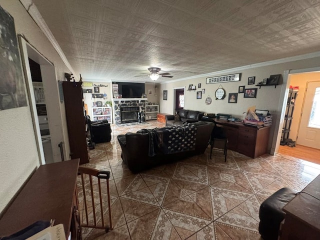 228 S Vine St, Milan, MO 63556 - tiled living room featuring ornamental molding, a ceiling fan, and a fireplace