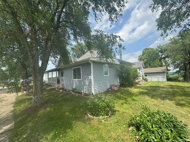 228 S Vine St, Milan, MO 63556 - view of property exterior with a yard