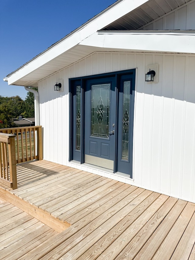 entrance to property with a wooden deck