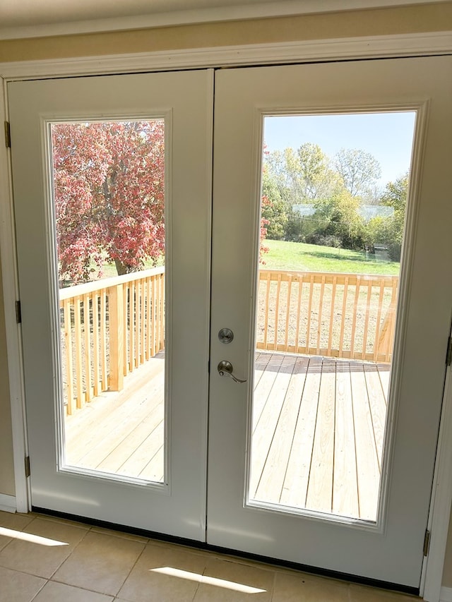 doorway featuring french doors and light tile patterned floors