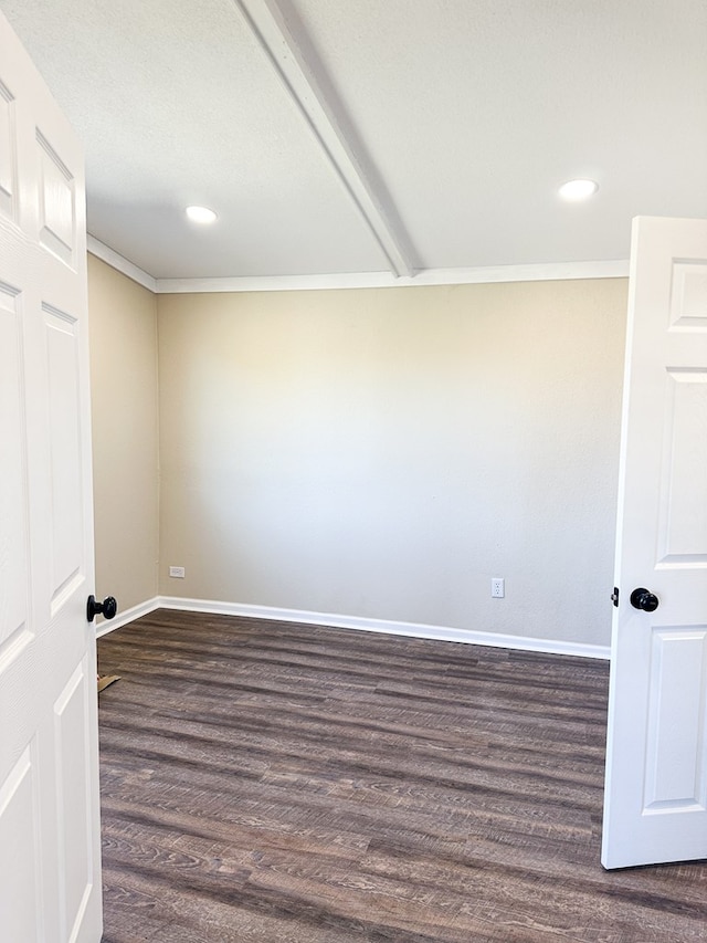 unfurnished room featuring dark hardwood / wood-style flooring and ornamental molding