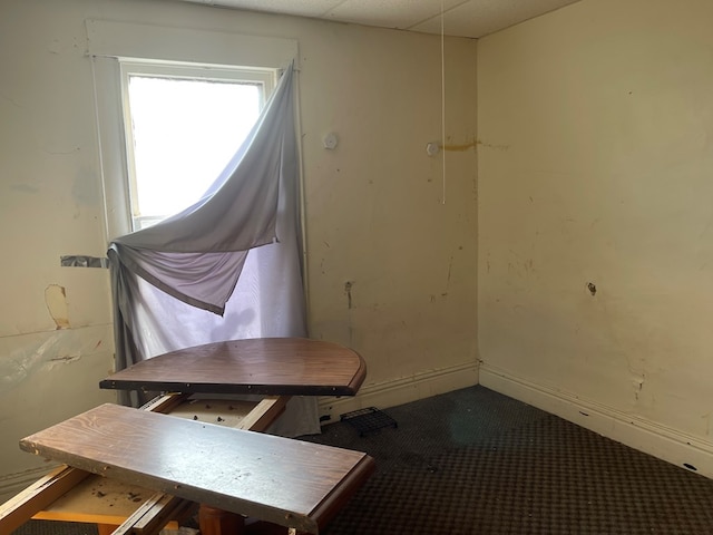 dining area featuring baseboards