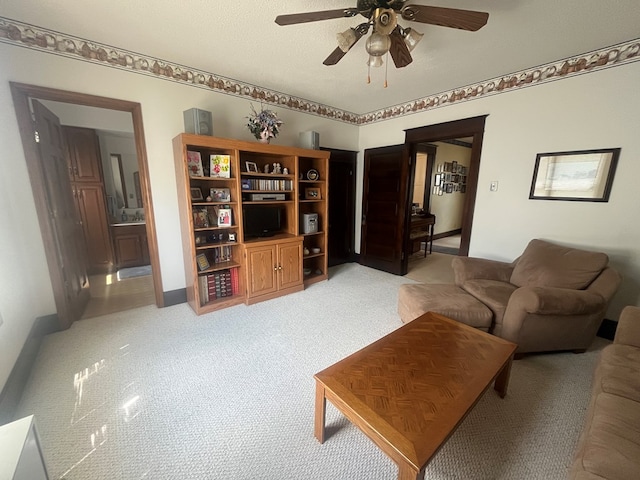 337 Calhoun St, Chillicothe, MO 64601 - living room featuring a ceiling fan and light colored carpet