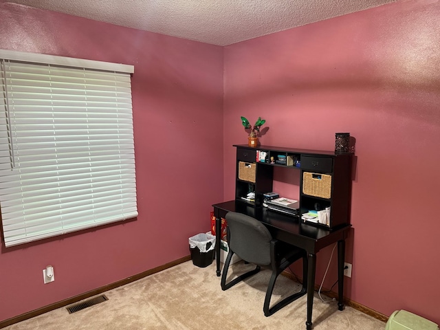 2515 N E St, Kirksville, MO 63501 - office space featuring a textured ceiling, carpet flooring, and baseboards
