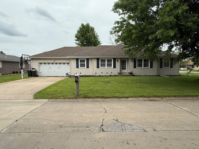 2515 N E St, Kirksville, MO 63501 - ranch-style house with an attached garage, a front yard, and driveway