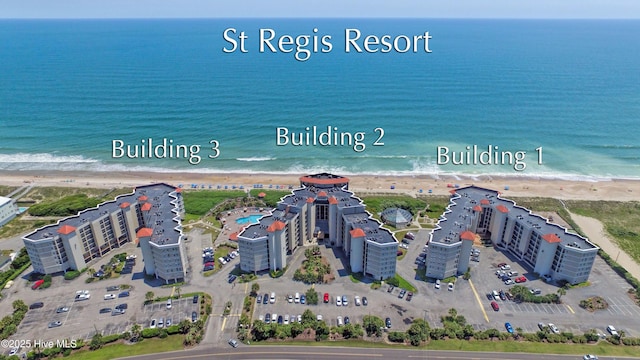 bird's eye view featuring a water view and a view of the beach