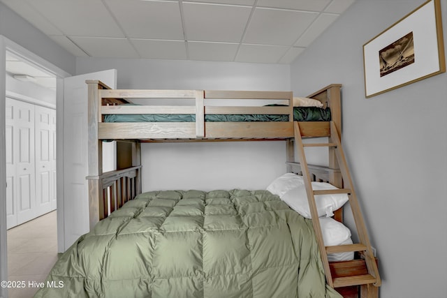 bedroom with a paneled ceiling