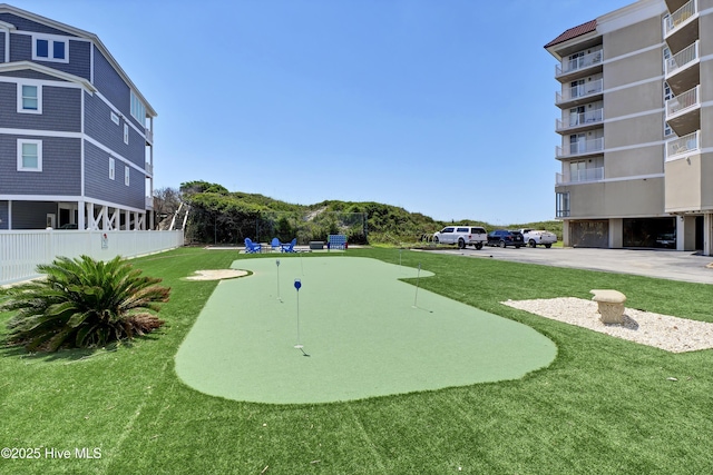 view of property's community featuring a lawn