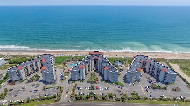bird's eye view featuring a beach view and a water view