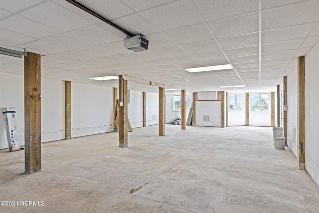 basement featuring a paneled ceiling