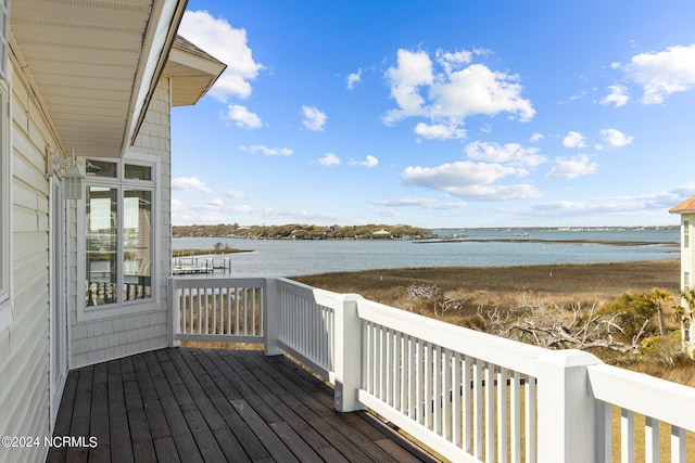 wooden deck featuring a water view