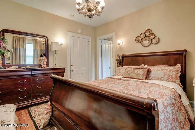 bedroom featuring a chandelier