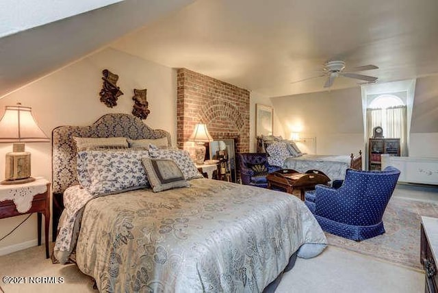 carpeted bedroom featuring ceiling fan and brick wall