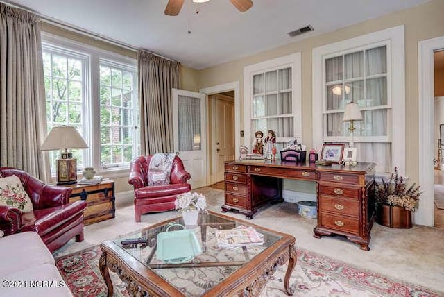 office area featuring ceiling fan and light colored carpet