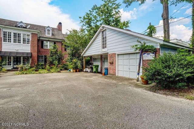 view of property exterior with a garage