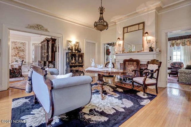 interior space featuring crown molding, wood-type flooring, and a chandelier