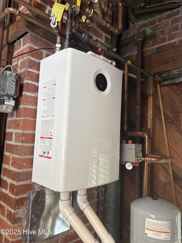 101 Spruce St, Washington, NC 27889 - utility room with water heater and gas meter