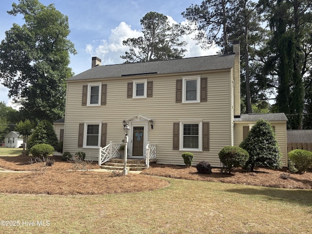 101 Spruce St, Washington, NC 27889 - colonial home with a chimney and a front yard