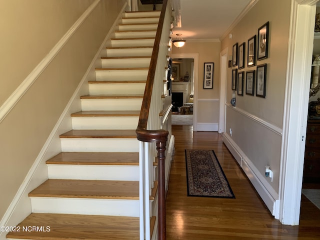 101 Spruce St, Washington, NC 27889 - staircase with wood finished floors and crown molding