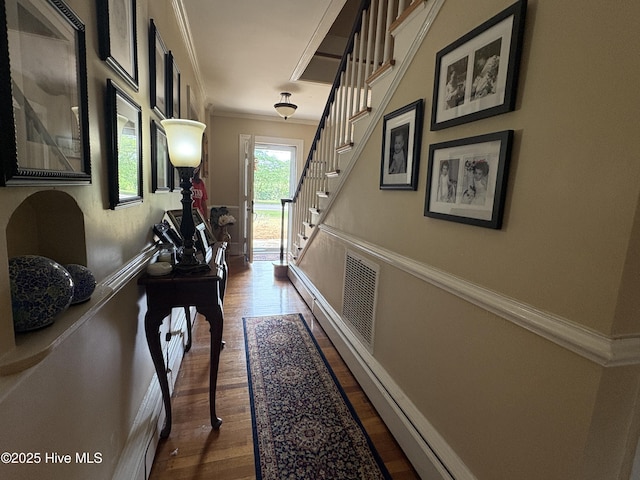 101 Spruce St, Washington, NC 27889 - corridor featuring wood finished floors, ornamental molding, and stairs