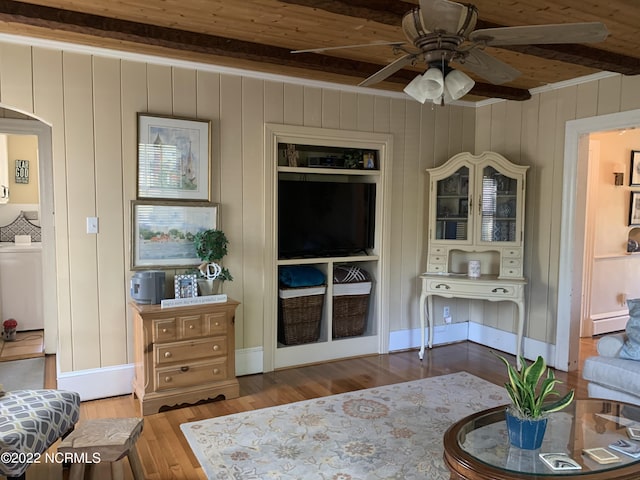 101 Spruce St, Washington, NC 27889 - living room with beam ceiling, baseboard heating, arched walkways, ceiling fan, and wood finished floors
