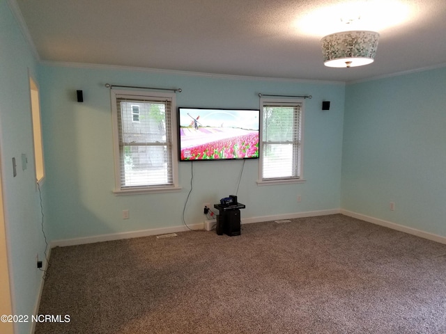 unfurnished room with dark colored carpet and crown molding