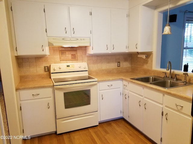 kitchen with white electric range oven, light wood-type flooring, white cabinetry, and decorative light fixtures