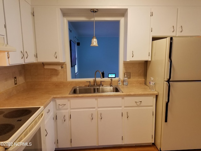 kitchen with white cabinetry, white appliances, and pendant lighting