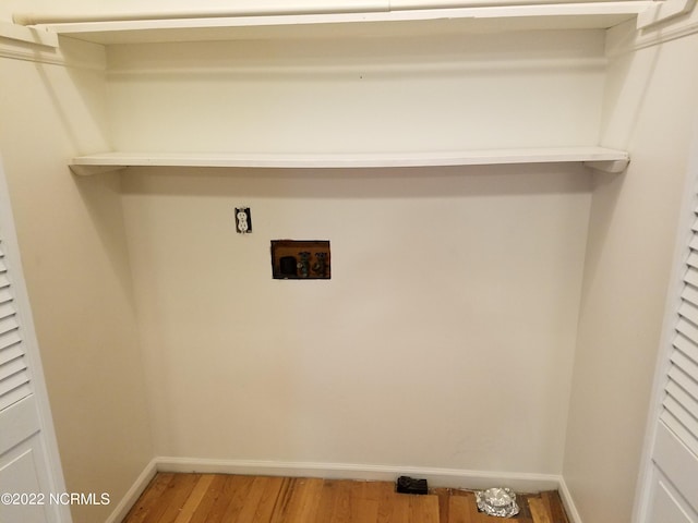 laundry area featuring hardwood / wood-style floors and washer hookup