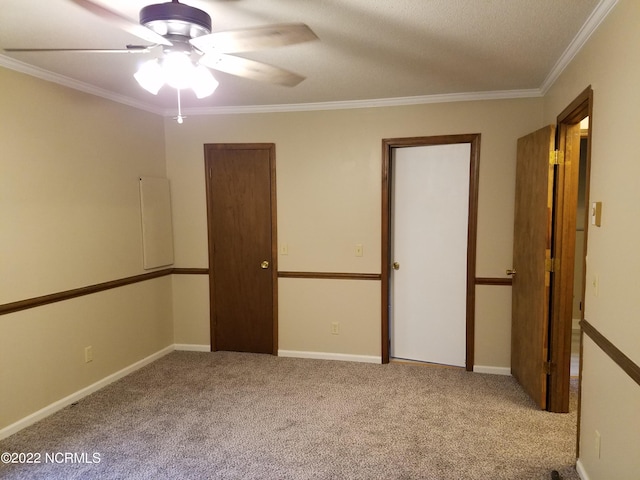 unfurnished bedroom with ceiling fan, crown molding, and light carpet