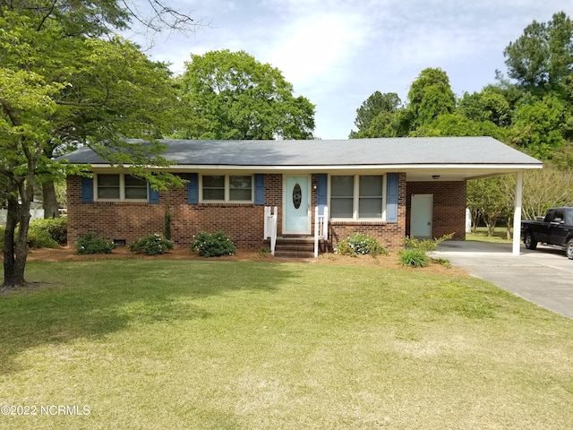 ranch-style home with a front lawn and a carport