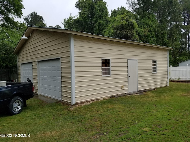 garage with a yard