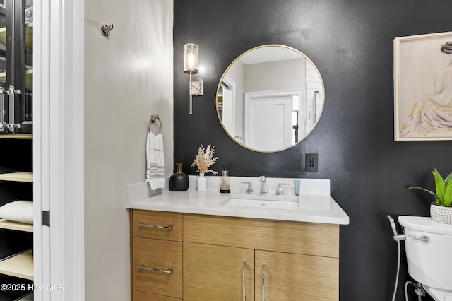 bathroom with vanity and toilet