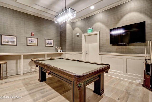rec room with wainscoting, billiards, a decorative wall, and light wood-style flooring