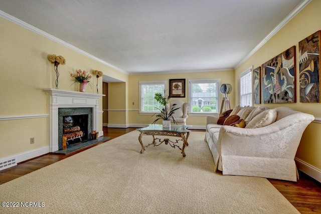 living room featuring dark wood-type flooring and crown molding