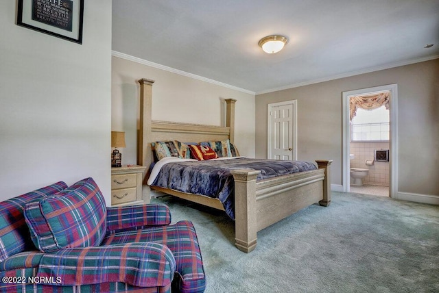 bedroom featuring crown molding, connected bathroom, and carpet floors