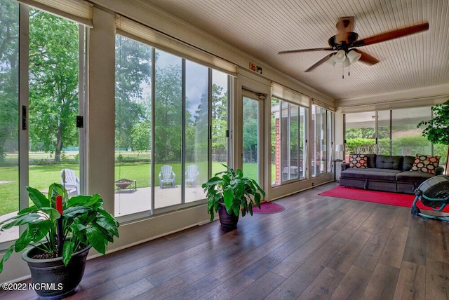 sunroom / solarium with ceiling fan and a wealth of natural light