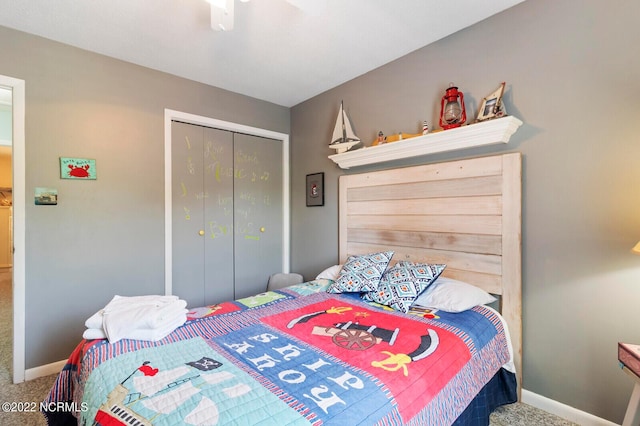 bedroom with a closet, carpet, and ceiling fan