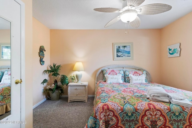 bedroom featuring ceiling fan and dark colored carpet