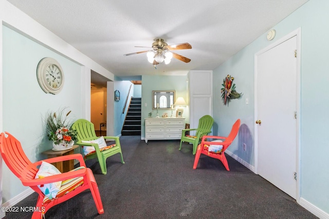 sitting room featuring ceiling fan