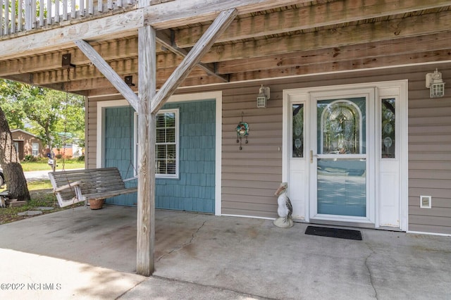 property entrance featuring a patio